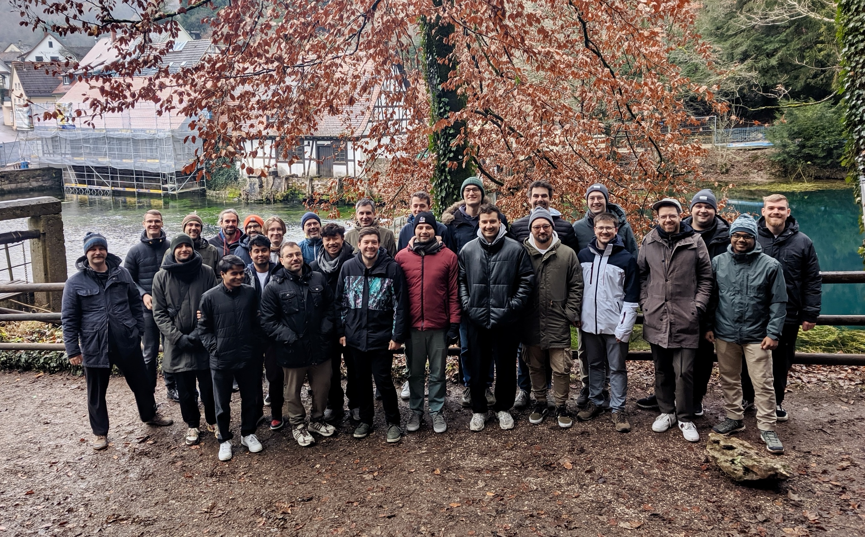 Hackathon team standing in front of Blautopf